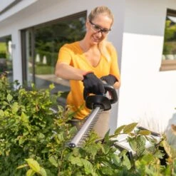 AL-KO HT 1845 18V Bosch Home & Garden Compatible Cordless Hedge Trimmer (Tool Only) -Garden Tool Store al ko ht1845 hedge trimmer lifestyle in use