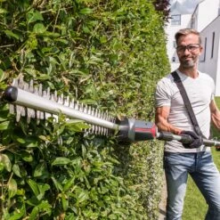 AL-KO HTA 1845 18V Bosch Home & Garden Compatible Cordless Long Reach Hedge Trimmer (with 2.5Ah Battery & Charger) -Garden Tool Store al ko hta1845 pole hedge trimmer lifestyle 2 1