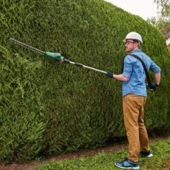 Bosch UniversalHedgePole 18V Cordless Long Reach Hedge Trimmer (with 2.5Ah Battery & Charger) (Bundle Builder) 12 Bosch UniversalHedgePole 18V Cordless Long Reach Hedge Trimmer (with 2.5Ah Battery & Charger) (Bundle Builder) -Garden Tool Store bosch universalhedgepole 18 lifestyle 1