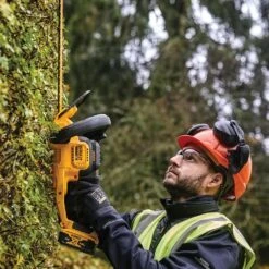 DeWalt DCMHT563P1-GB 18V XR Cordless Hedge Trimmer (with 5Ah Battery & Charger) -Garden Tool Store dewalt dcmht563 hedge trimmer lifestyle