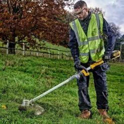 DeWalt DCMST561P1-GB 18V XR Cordless Grass Trimmer (with 5Ah Battery & Charger) -Garden Tool Store dewalt dcmst561 grass trimmer lifestyle 2