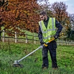 DeWalt DCMST561P1-GB 18V XR Cordless Grass Trimmer (with 5Ah Battery & Charger) -Garden Tool Store dewalt dcmst561 grass trimmer lifestyle