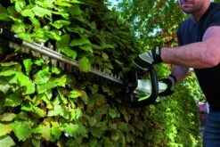EGO Power+ HT2410E 60cm 56V Cordless Hedge Trimmer (Bare Tool) -Garden Tool Store ego ht2410 lifestyle side hedge