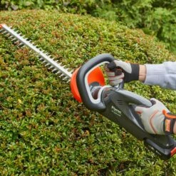 Flymo UltraCut 500 18V Cordless Hedge Trimmer (with 2.5Ah Battery & Charger) (Bundle Builder) -Garden Tool Store flymo ultracut500 hedge trimmer lifestyle 1