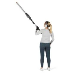 Flymo UltraReach 420 18V Cordless Pole Hedge Trimmer (with 2.5Ah Battery & Charger) (Bundle Builder) -Garden Tool Store flymo ultrareach 420 pole hedge trimmer in use 1