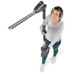 Flymo UltraReach 420 18V Cordless Pole Hedge Trimmer (with 2.5Ah Battery & Charger) (Bundle Builder) -Garden Tool Store flymo ultrareach 420 pole hedge trimmer rotating head in use 1