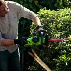 GreenWorks G40HT61K2 G-MAX 40V Cordless Hedge Trimmer (with 2Ah Battery & 2A Charger) -Garden Tool Store greenworks g40ht61 hedge trimmer lifestyle 2 1