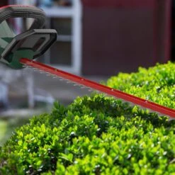 Webb Eco WEV20HTB2 20V Cordless Hedge Trimmer (with 2Ah Battery & Charger) -Garden Tool Store webb eco wev20htb2 hedge trimmer blade lifestyle