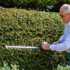 Webb WEV20HT 20V Cordless Hedge Trimmer (with 2Ah Battery & Charger) -Garden Tool Store webb wev20ht hedge trimmer lifestyle 4