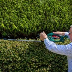 Webb WEV20HT 20V Cordless Hedge Trimmer (with 2Ah Battery & Charger) -Garden Tool Store webb wev20ht hedge trimmer lifestyle 5